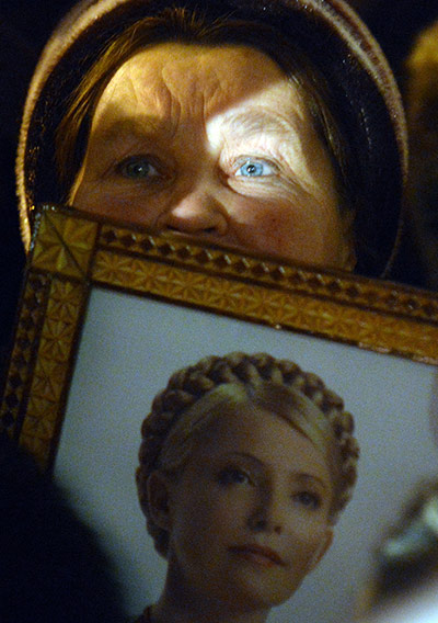 24 hours in pictures: A protestor holds a picture of Yulia Tymoshenko