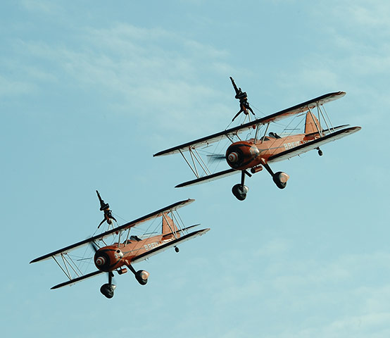 24 hours in pictures: The Breitling Wingwalkers, an aerobatic team, perform 