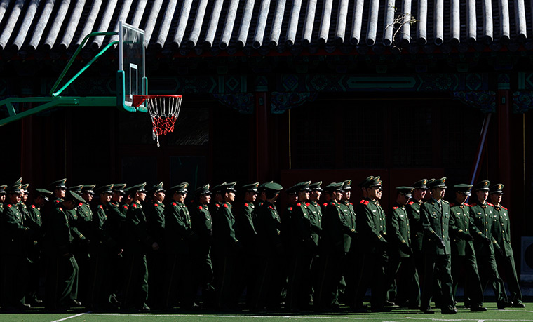Carlos Barria China: Paramilitary policemen march inside of the Forbidden City