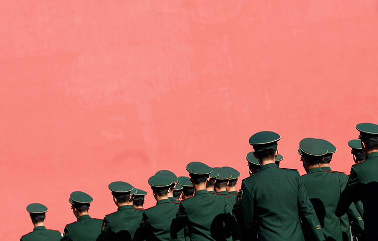 Carlos Barria China: Paramilitary policemen march inside of the Forbidden City