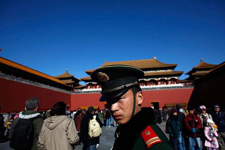 Carlos Barria China: A paramilitary policeman guards an area inside the Forbidden City