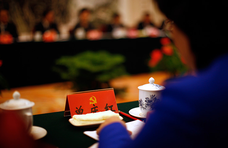 Carlos Barria China: A delegate attends a meeting at the Great Hall of the People
