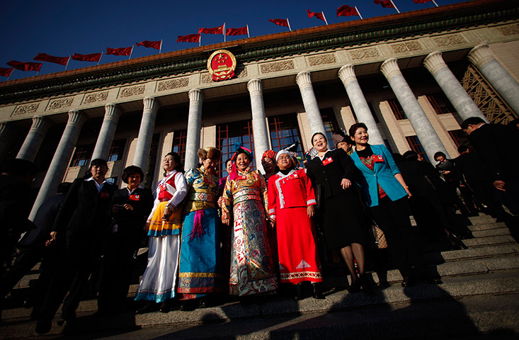 Carlos Barria: Ethnic minority delegates in front of the Great Hall of the People