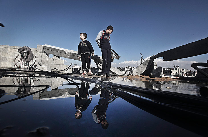 24 hours in pictures: Palestinians inspect damage after air strike