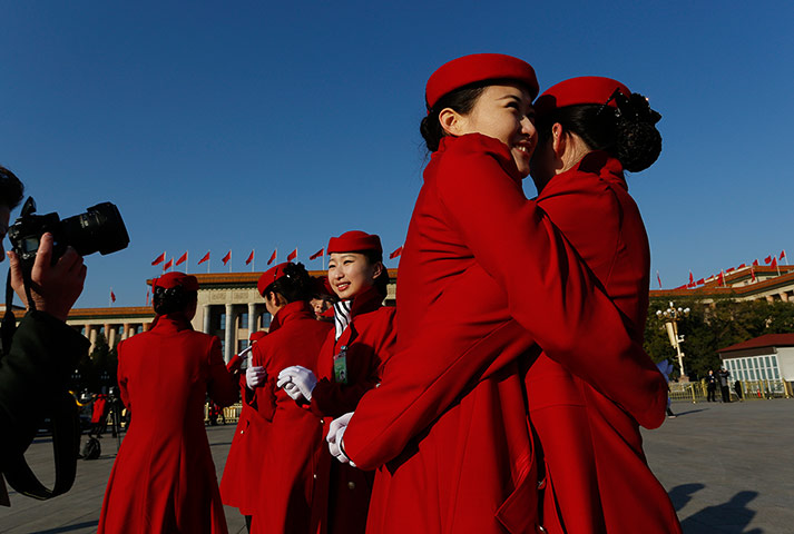 24 hours in pictures: Hostesses for the National Congress, Beijing