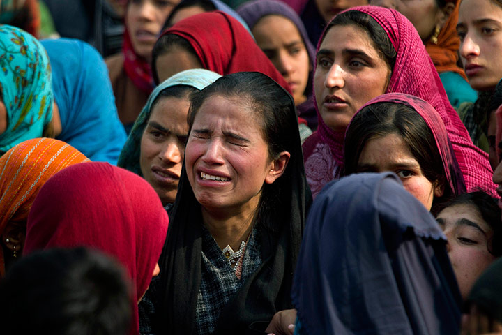 24 hours in pictures: Kashmiri villagers grieve during a funeral 