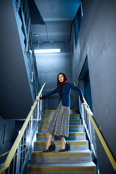 Fashion: Illusions: Model wearing a geometric skirt and blue blazer