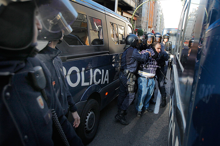 Euro protests: Madrid, Spain: Riot police arrest a protestor during a general strike 