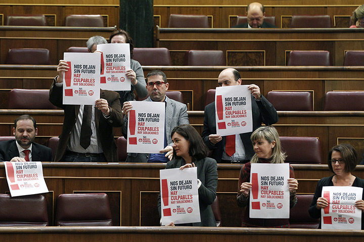 Euro protests: Madrid, Spain: 7Socialist party PSOE's parliamentarians hold posters