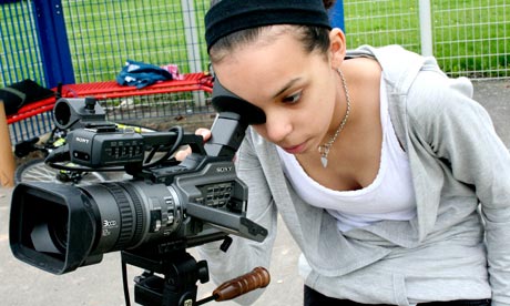 A young woman with a video camera