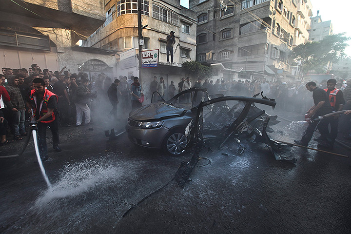 Hamas Ahmed al-Jaabari: Emergency services extinguish the burned out destroyed car