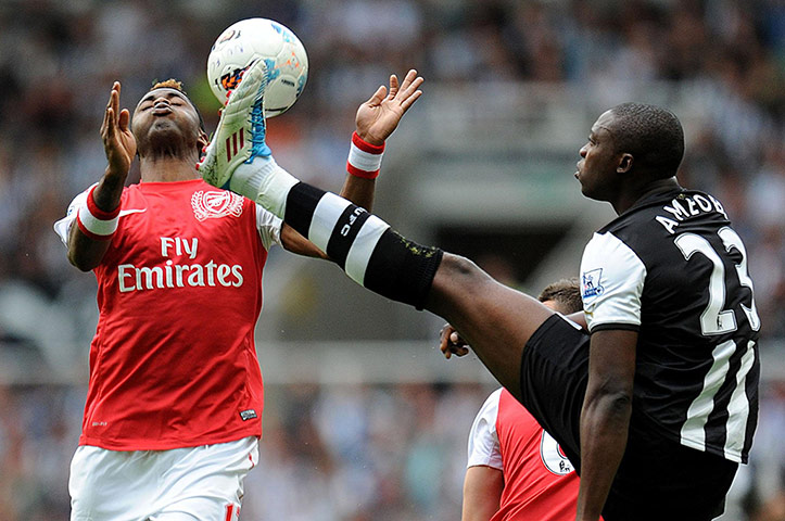 barclay photos: Arsenal's Alex Song and Newcastle United's Shola Ameobi battle for the ball