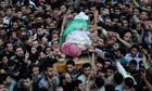 Palestinian Hamas members carry the body of Ahmed al-Jabari during his funeral in Gaza City