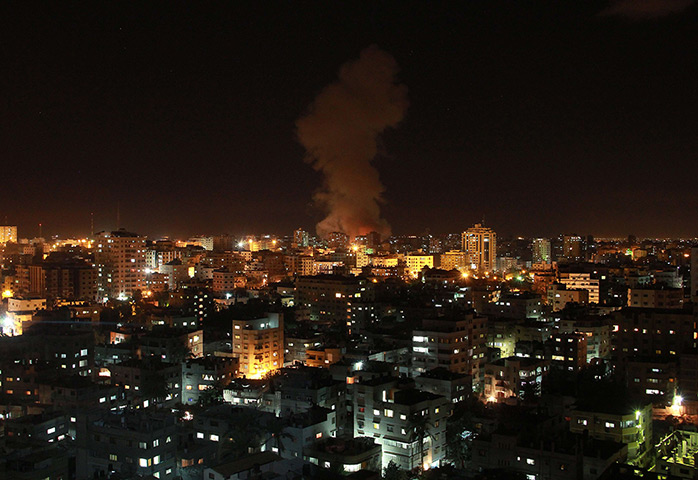 Gaza and Israeli strikes: Gaza City: Smoke rises following an Israeli air strike on a house 