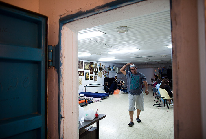 Gaza and Israeli strikes: Netivot, Israel: Israelis stay in a bomb shelter during aerial attacks