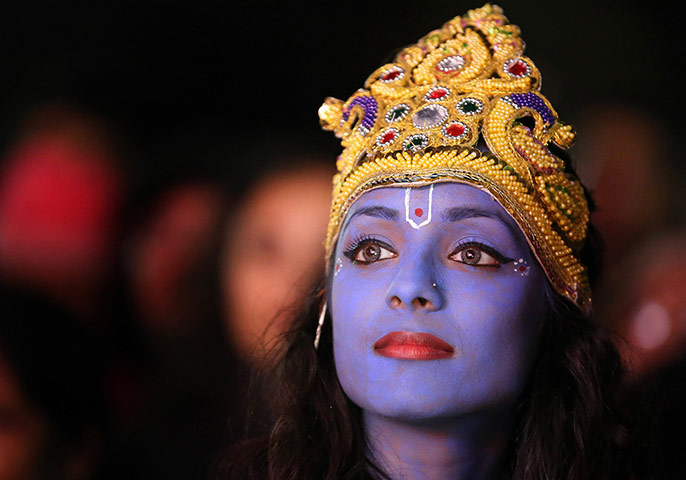 Diwali: A dancer waits to perform on stage as Lord Krishna in Leicester