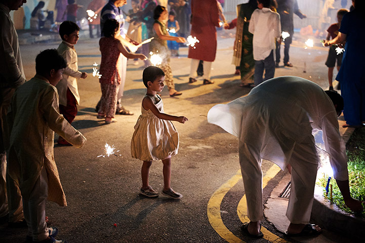Diwali: Children light sparklers during Diwali in Singapore