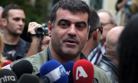 In this Monday, Oct. 29, 2012 photo journalist and magazine publisher Costas Vaxevanis makes statements outside a court in Athens.