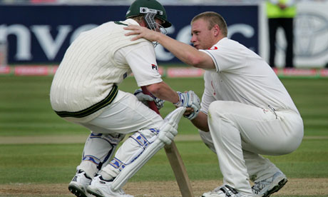 Flintoff consoles Australia’s Brett Lee after England narrowly win the Ashes in 2005.