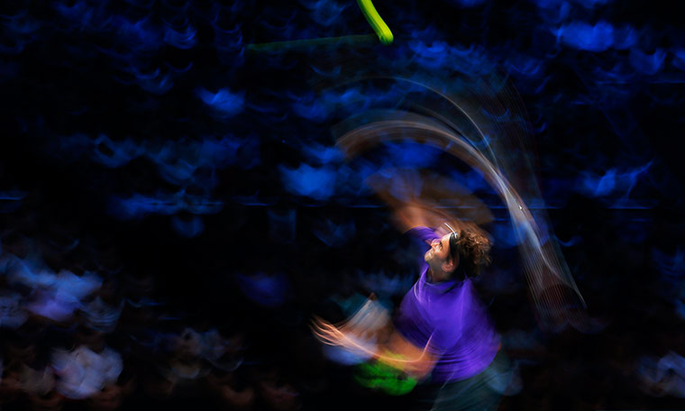 20 Photos: Roger Federer of Switzerland serves to Novak Djokovic of Serbia in London