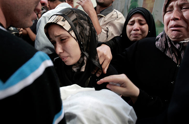20 Photos: The parents of a Palestinian baby, killed in an Israeli strike, in Gaza