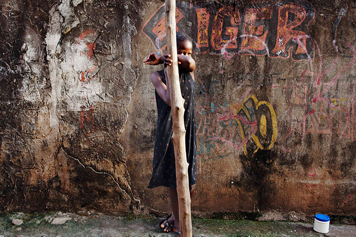 24 hours: A girl watches voters at a polling station