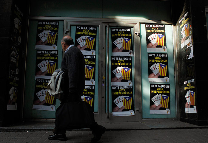 24 hours: A man walks past separatist banners in Barcelona