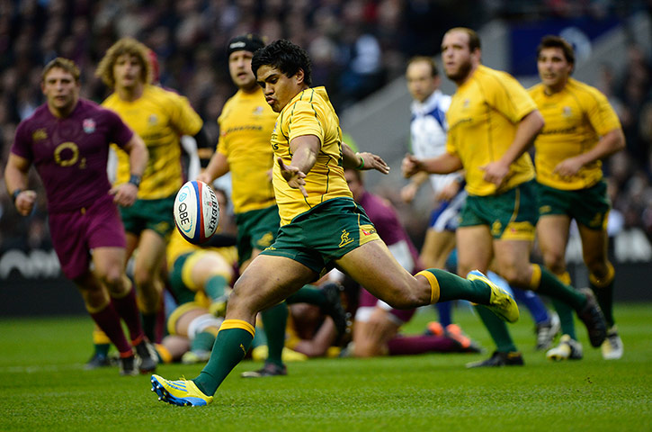 eng v australia: Aussie centre Ben Tapuai hoofs the ball clear