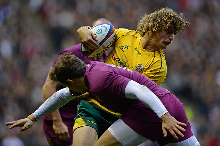 eng v australia: Australian try-scorer Nick Cummins evades a tackle from Alex Goode