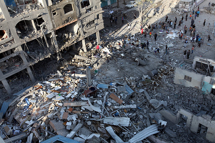 Gaza: Palestinians survey the remains of a destroyed building in Beit Lahiya