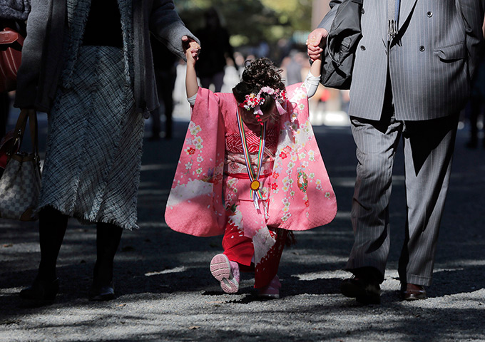 24 hours in pictures: A girl wearing kimono