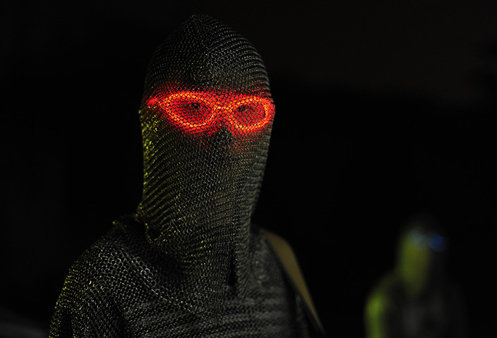 24 hours in pictures: A Thunderbolt Craziness guitarist is seen wearing a metal suit