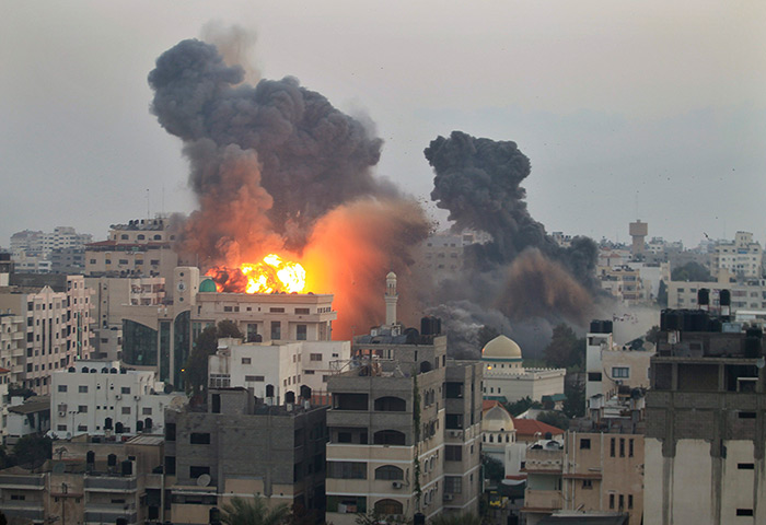 Gaza conflict: Smoke and fire from an Israeli bomb rises into the air ove Gaza City 