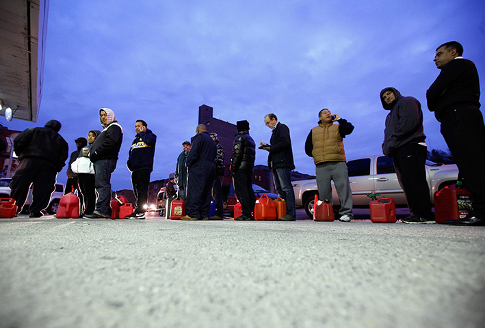 Superstorm sandy supplies: People wait for gas at a Hess fuelling station in Brooklyn