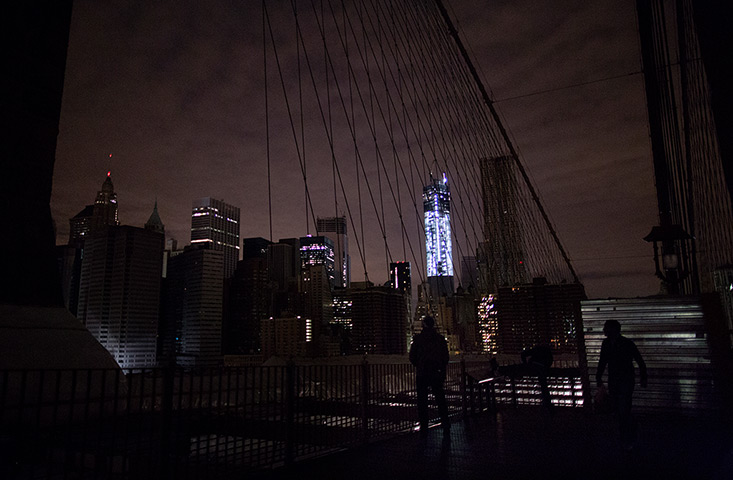 Superstorm sandy supplies: Much of lower Manhattan remains dark from the Brooklyn Bridge