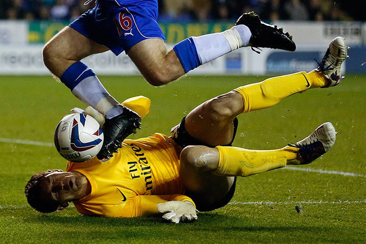 week in sport pictures: Reading's Tabb challenges Arsenal's goalkeeper Martinez