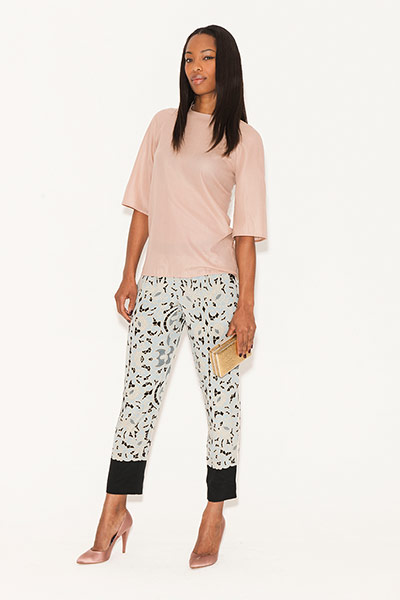 All Ages: Trousers: model wears pale blue with black print cocktail trousers and peach top