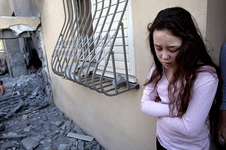 Israel Gaza : An Israeli girl stands outside her house in Beersheba, Israel