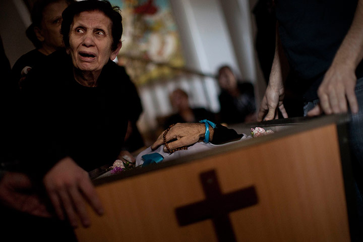 Israel Gaza : A Palestinian mourner cries during the funeral of Salem Paul Sweliem, Gaza