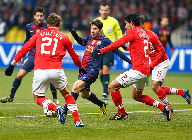 Tuesday champions league: Spartak Moscow's Kallstrom & Insaurralde vie with Barcelona's Lionel Messi