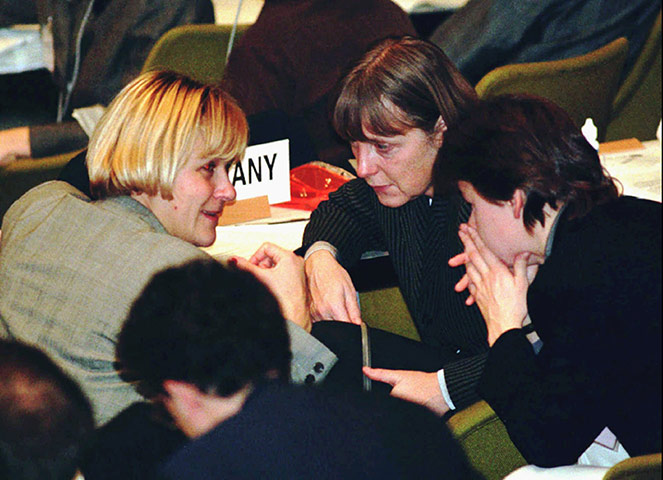 Kyoto history: Environment Miniters Dominique Voynet, left, of France, Angela Merkel