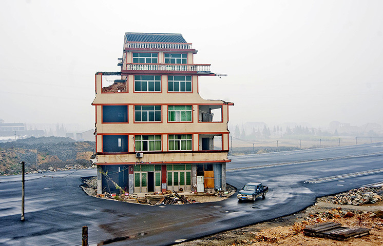 China demolition: A house sits in the middle of a newly built road in Wenling city, China