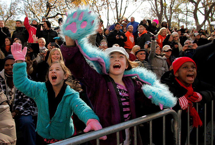 Thanksgiving: Children wave to Santa Claus on Central Park West 