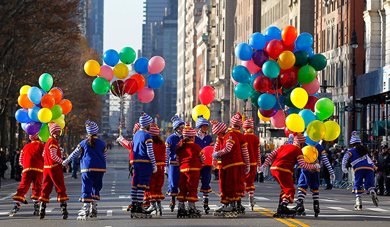Thanksgiving: Clowns skate along Central Park West before the start of the parade