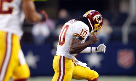 Washington Redskins quarterback Robert Griffin III celebrates a touchdown pass during his team's Thanksgiving Day win over the Dallas Cowboys