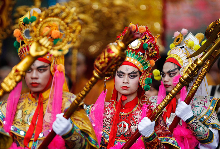 24 hours in pictures: Buddhist believers dressed as the Yaksas 