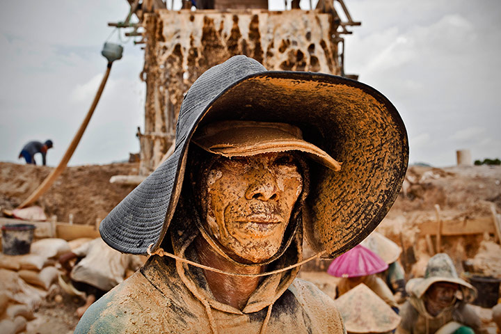 Tin Mining: Portrait of a tin miner at a PT Timah tin ore mine in Tanjung Pesona