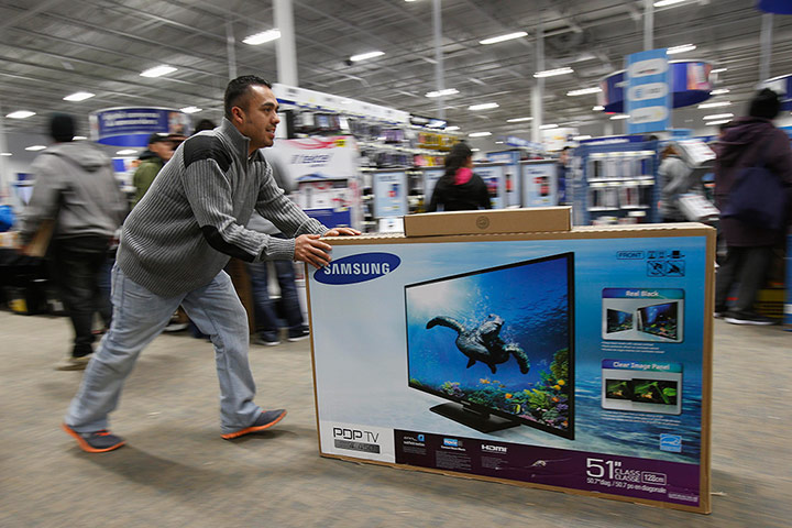 Black Friday: San Francisco, California: A man pushes a flat-screen television