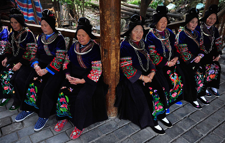 24 hours: Ethnic Miao women wearing their traditional gowns