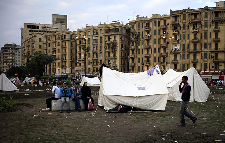 Anti-Morsi protests: Egyptian protesters sit beside their tents in the center of Tahrir Square